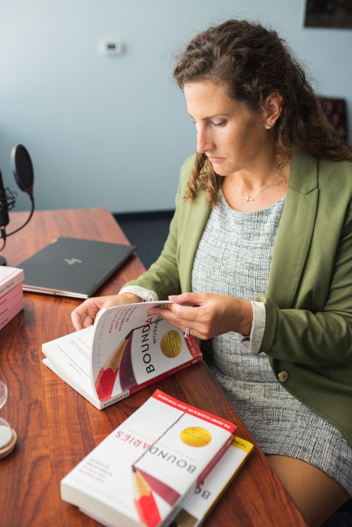 Woman reading Boundaries books